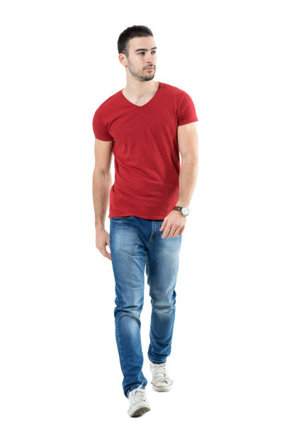 istock Young handsome casual man walk towards camera looking away 669907256