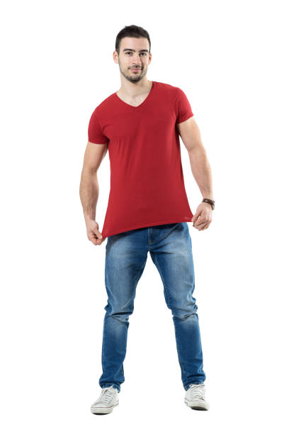 istock Young man stretching and showing red t-shirt blank copy space. 669907322