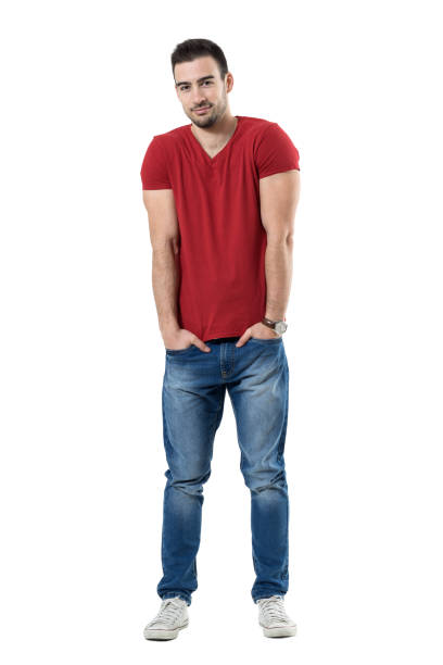 istock Smiling handsome casual man with hands in pockets looking at camera 669907418