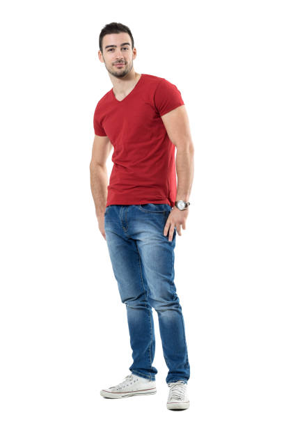 istock Cool confident casual young guy with hands in pockets looking at camera 669907750