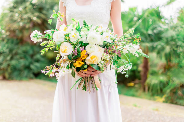 istock Bride in white dress with beautiful wedding bouquet. Wedding style. 669908054