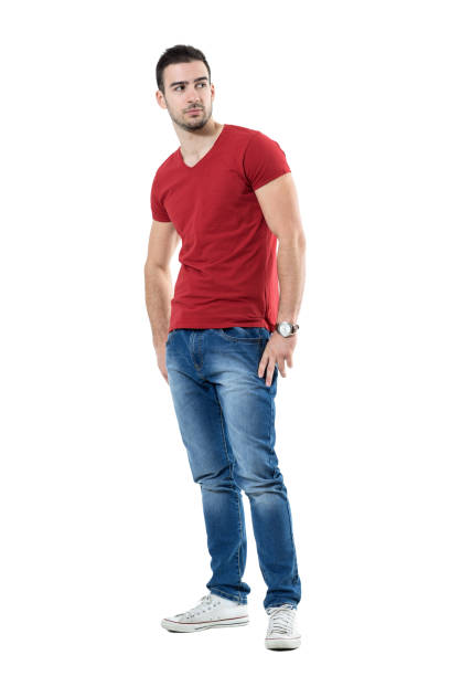 istock Macho confident young man with hands in pocket looking over shoulder. 669908612