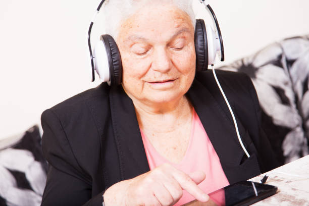 istock Senor woman with diigital tablet 669910850
