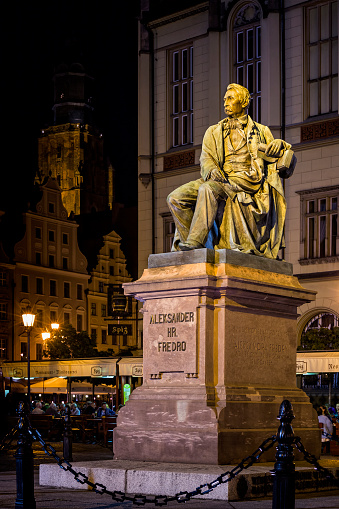 Wroclaw, Poland - August 17, 2016:  Aleksander Fredro Monument in famous Old Market Square, Wrocław, Poland. The monument was made by Leonard Marconi in 1879