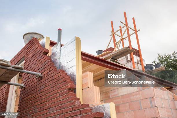 Construction Building Of New House With Insulation Stock Photo - Download Image Now - Construction Industry, House, Building - Activity