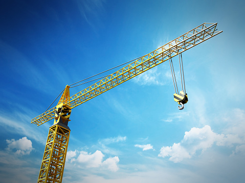 Yellow construction frame against blue sky background