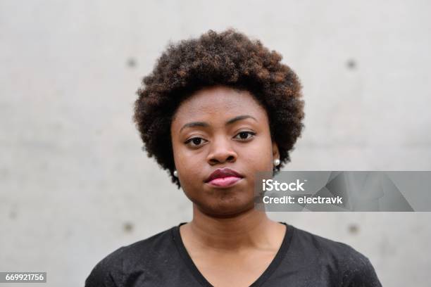 Portrait Of Young Black Woman Stock Photo - Download Image Now - Serious, Women, One Woman Only