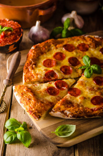 istock Homemade cheese pizza with salami 669923416