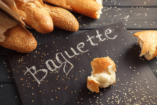 istock French baguettes with sesame seed on black wooden background 669927364