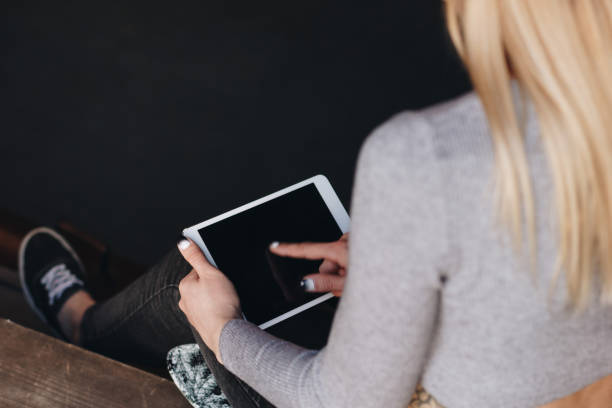istock Young girl with tablet 669927436