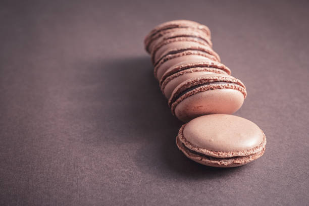 istock Row of Chocolate pastel brown Macarons or Macaroons 669930476