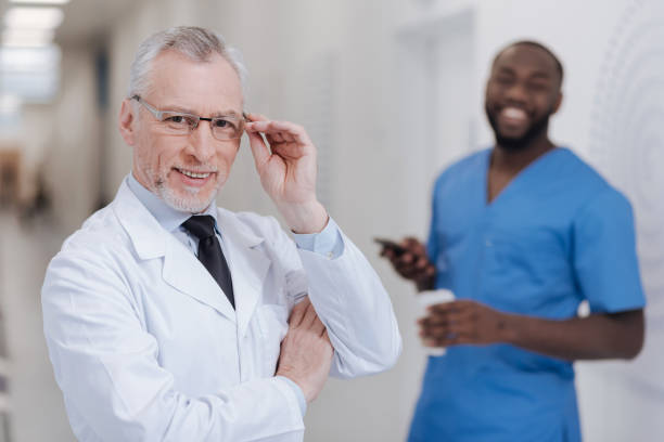 istock Aged physician enjoying responsibilities with young colleague in the clinic 669937310
