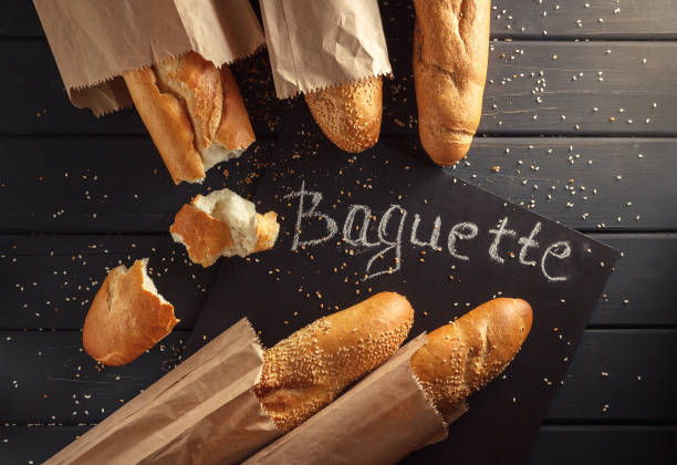 istock French baguettes with sesame seed on black wooden background 669937766