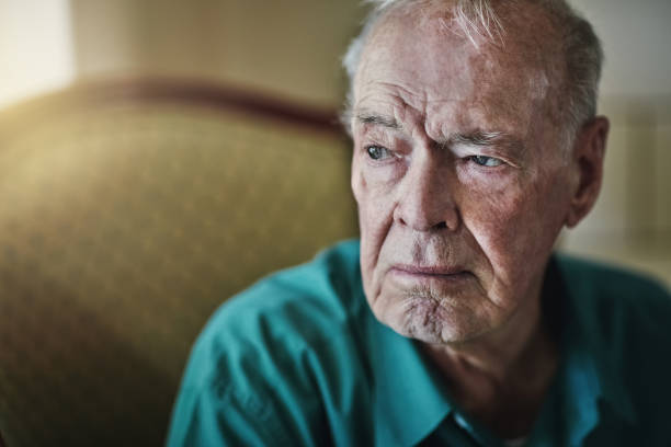 Who will take care of you when you're old? Cropped shot of a senior man sitting by himself in a living room old man depressed stock pictures, royalty-free photos & images