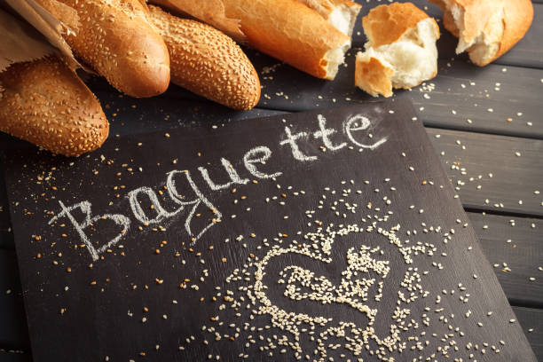 istock French baguettes with sesame seed on black wooden background 669940710