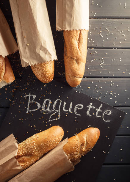 istock French baguettes with sesame seed on black wooden background 669944192