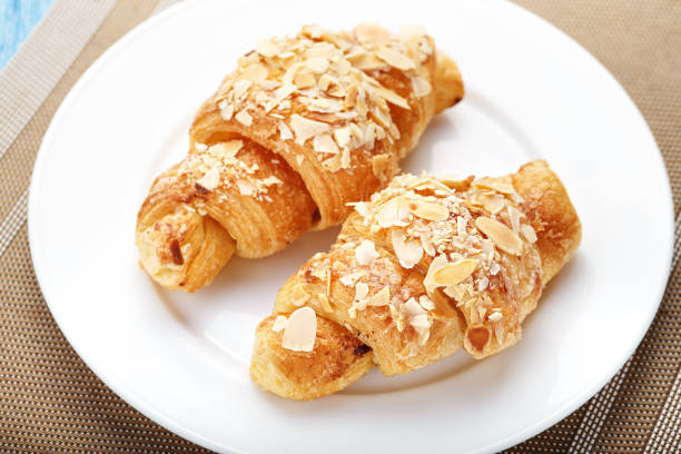 istock croissant with almonds on a napkin 669955610