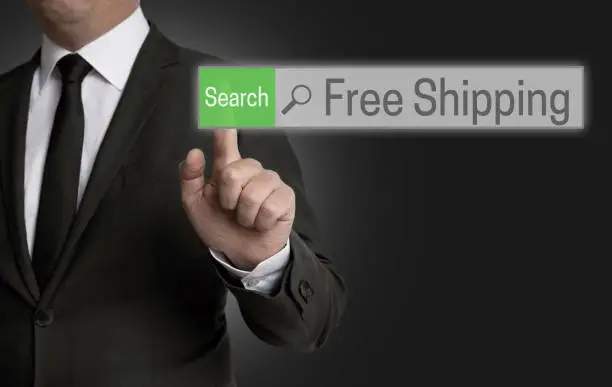 Free shipping browser is operated by businessman concept.