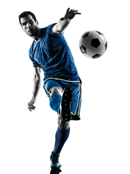 istock soccer player man kicking silhouette isolated 669966148