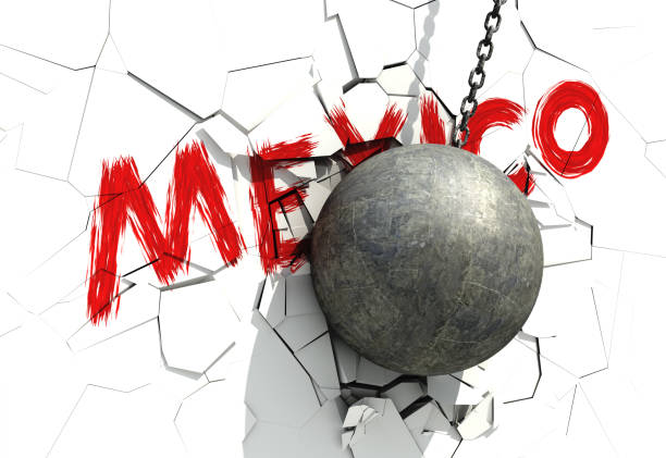 istock Metallic Wrecking Ball Shattering White Wall With Red Inscription 669966370