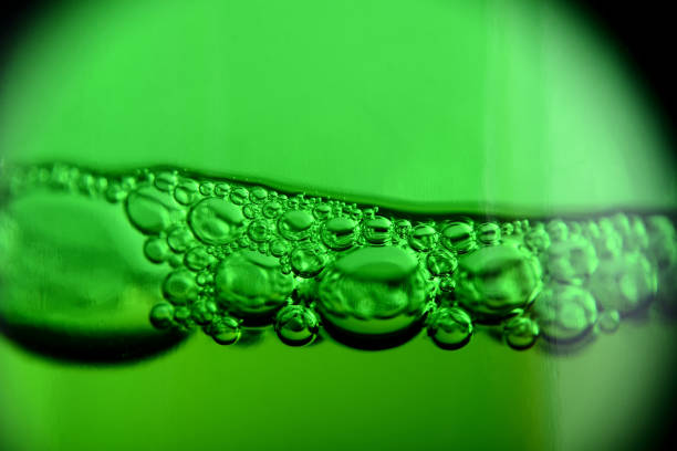 istock Light beer with bubbles in the bottle macro shot 669966572
