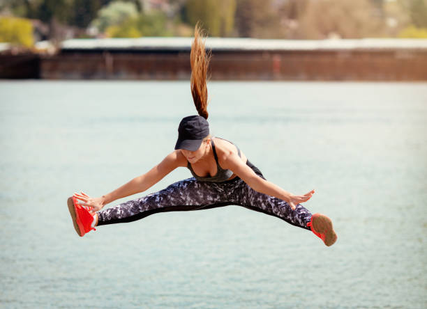 istock Cute Girl Exercising On The Beach 669966946