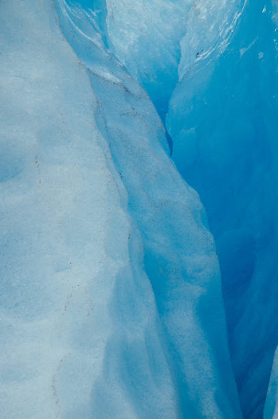 istock Blue colors of ice inside glacier 669971682