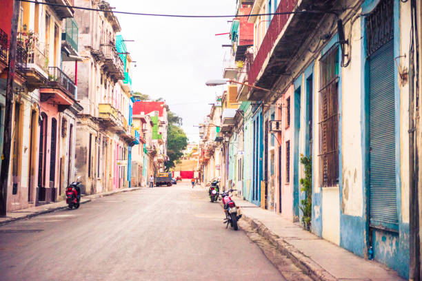 This is a horizontal, color photograph of the colorful Havana, Cuba architecture. CreativeContentBrief 696189239