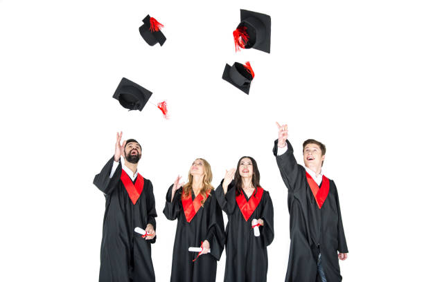 istock happy young students with diplomas throwing graduation caps isolated on white 669978232
