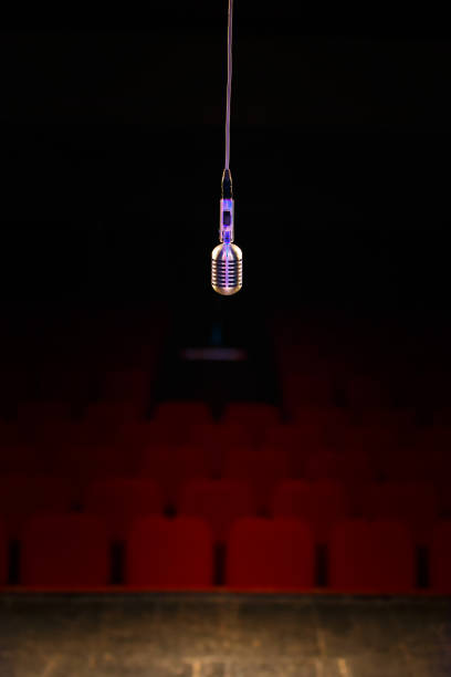 Microphone in the stage lights stock photo