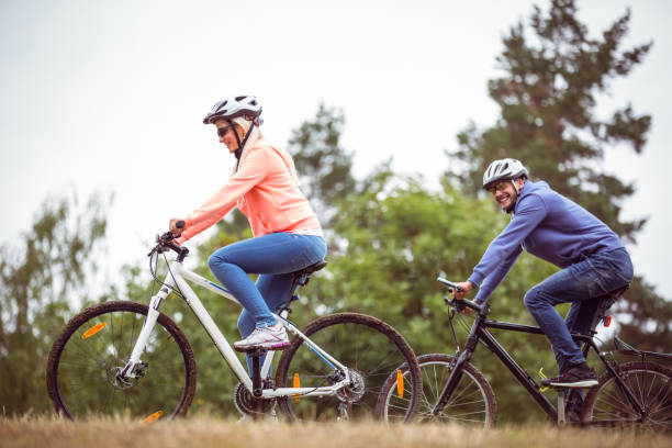 istock Happy couple on a bike ride 669981630