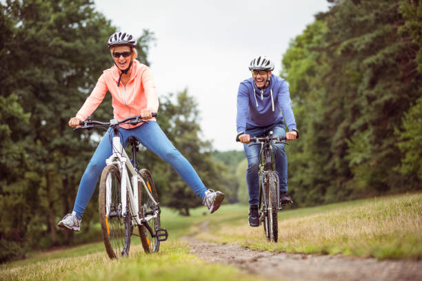 istock Happy couple on a bike ride 669981720