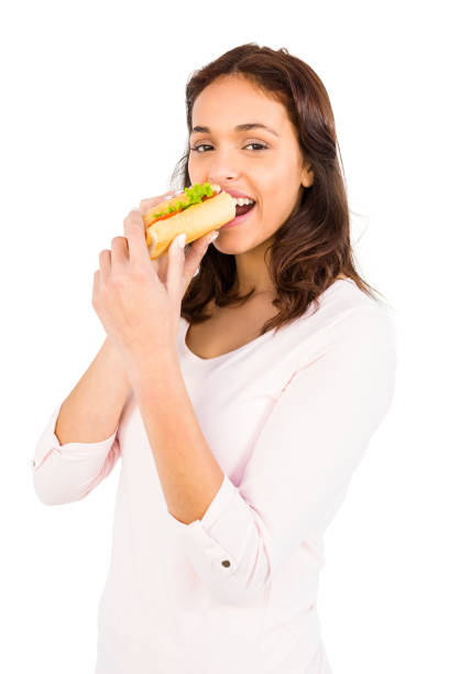 istock Smiling woman eating sandwich 669981770