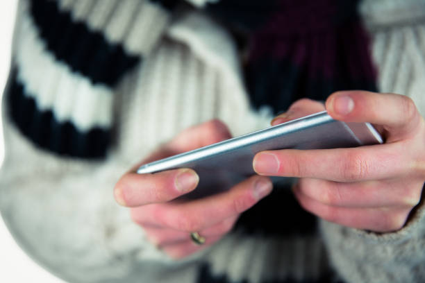 istock Cute woman using her smartphone 669985778