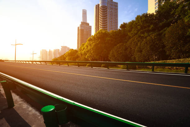 istock Empty road surface floor with city landmark buildings 669985866