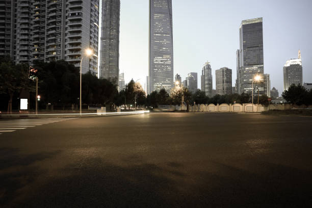 istock Empty road surface with city landmark buildings of evening 669988580