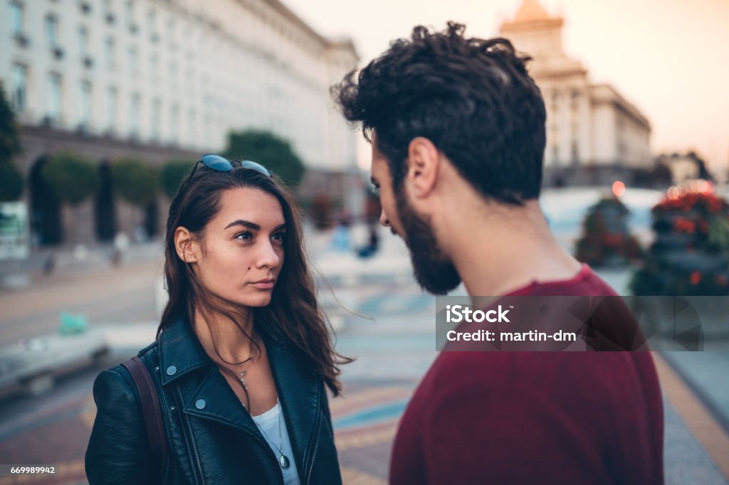 Young couple arguing at the street Disappointed woman from her boyfriend Couple - Relationship Stock Photo
