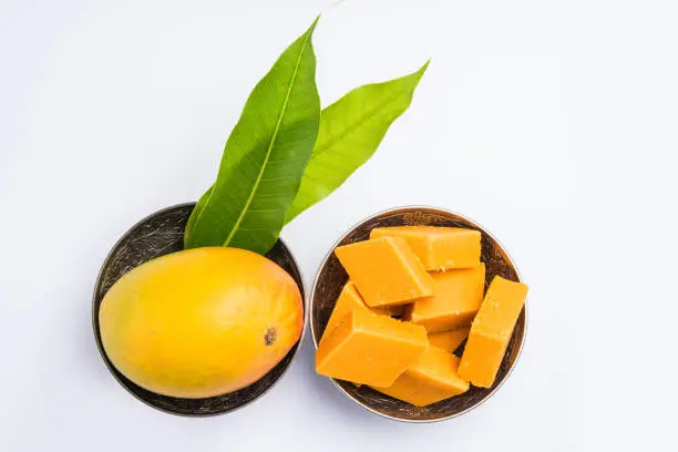 Photo of Indian sweet - traditional mango burfi or cake or bar made up of authentic alphonso or hapus mangos from konkan, india