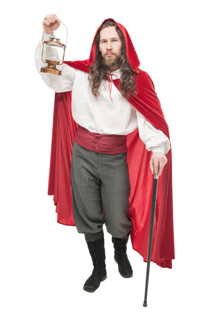 istock Medieval man in cape with cane and lamp isolated 669996508