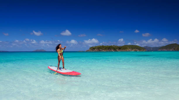 istock young attractive woman on paddleboard 669996540