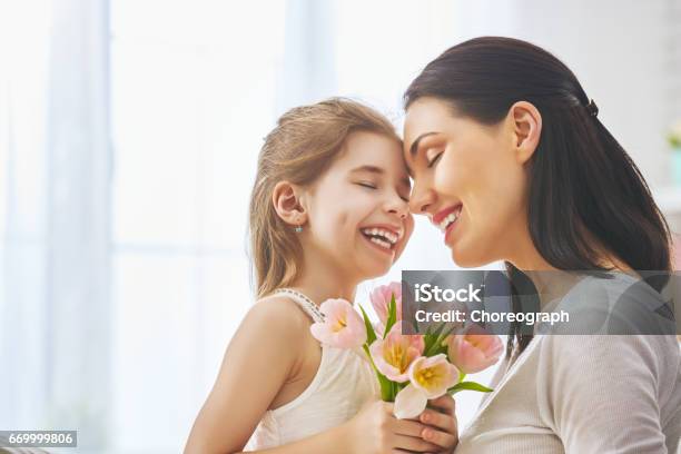 Daughter Congratulates Mom Stock Photo - Download Image Now - Mother, Flower, Gift