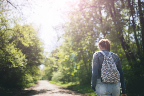 istock Young woman walking on the park 670000236