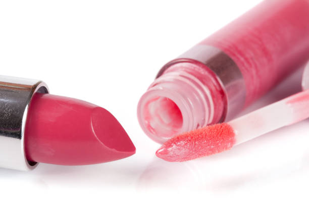 istock Pink lipstick and lip gloss isolated on white background 670001084