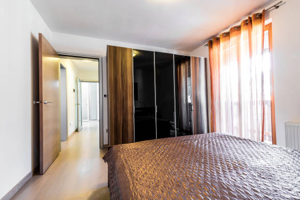 istock Modern hotel bedroom with bed and closet. 670003576