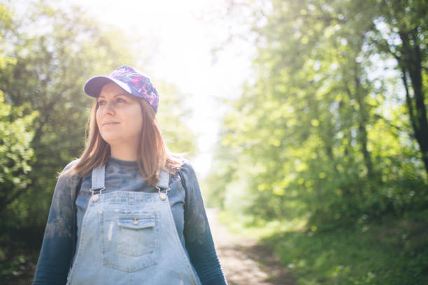 istock Young woman walking on the park 670003840