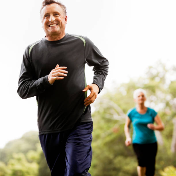 istock Mature Man and Woman Jogging 670004676