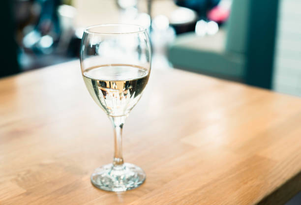 istock Glass with apple cider on wooden table in cafe. 670004884
