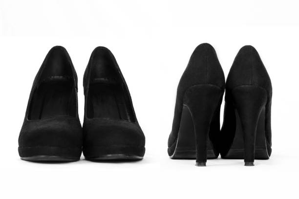istock Beautiful black female shoes, isolated on white 670004940