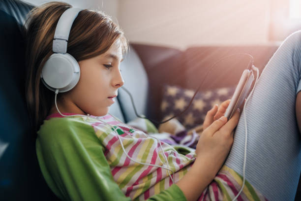 Girl using tablet and listening music