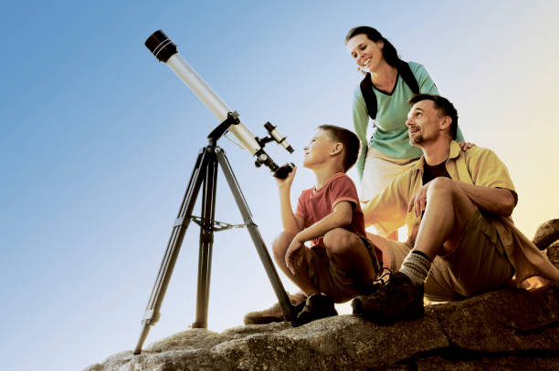 istock Parents and Son with Telescope 670007616